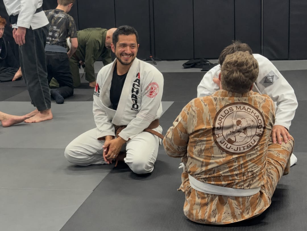 Coach Elias Aurelio working with students